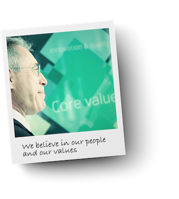 Employee profile in front of core value blackboard